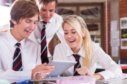 Group of high school students using a tablet